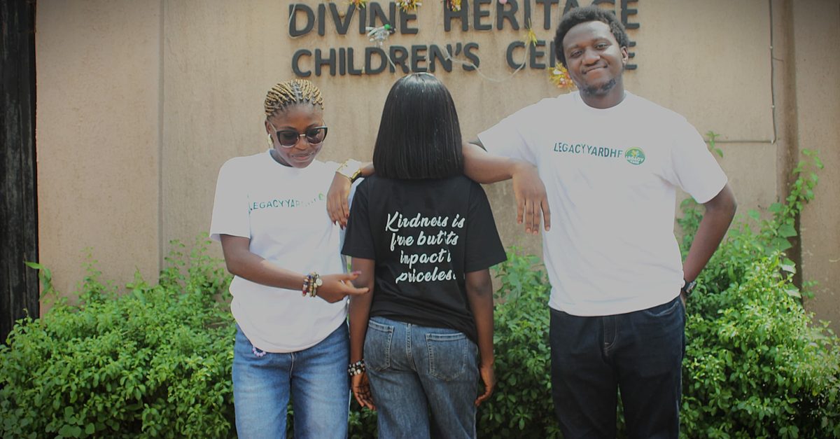 LYHF team members at Divine Heritage Children's Centre, with a shirt reading kindness is free but its impact is priceless