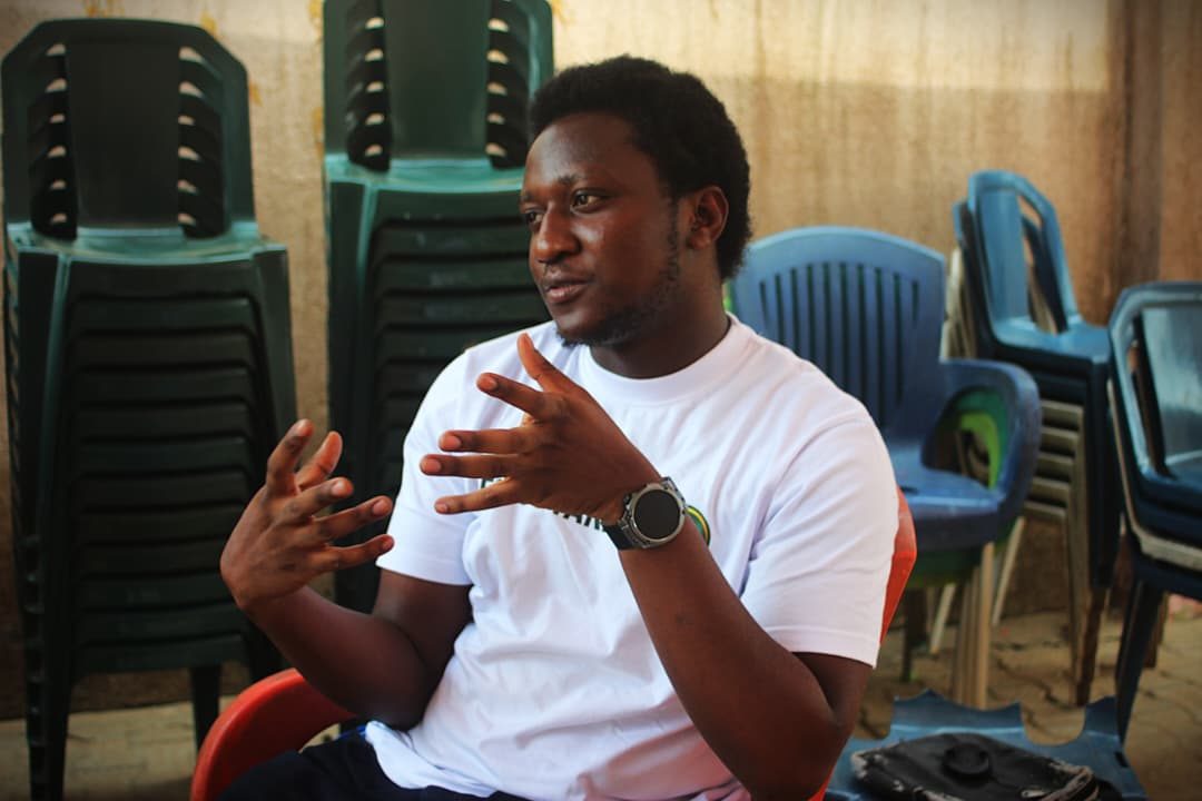 Speaker addressing a gathering at the 2025 Charis project